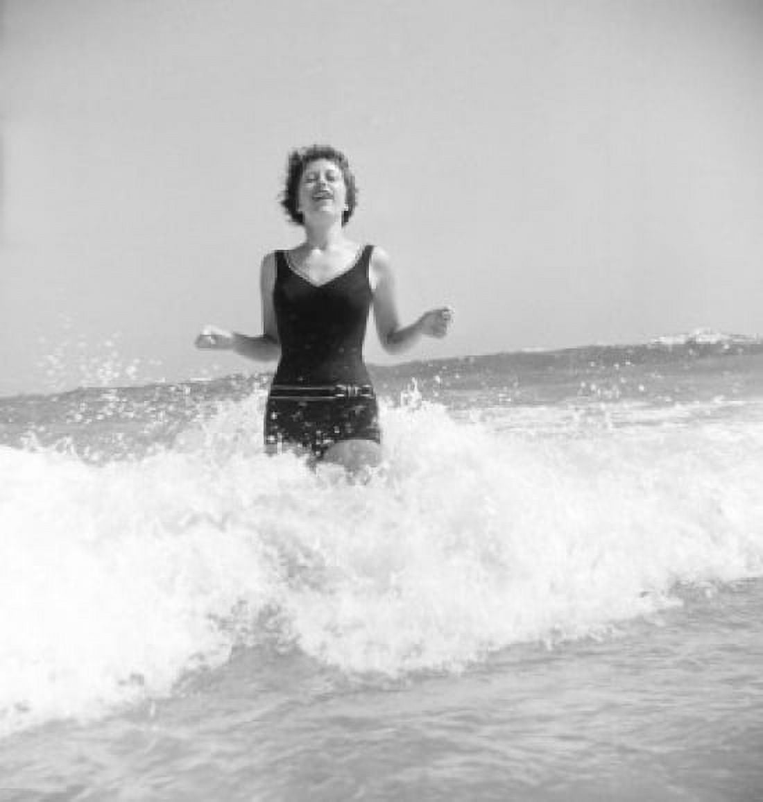 Young woman standing in surf Canvas Art - (24 x 36)