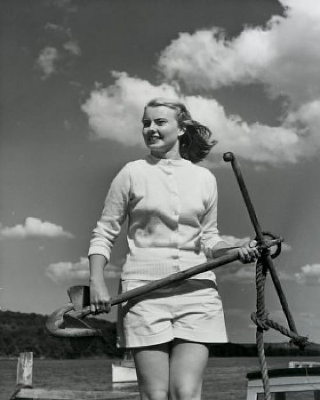 Young woman standing on boat holding anchor Canvas Art - (18 x 24)