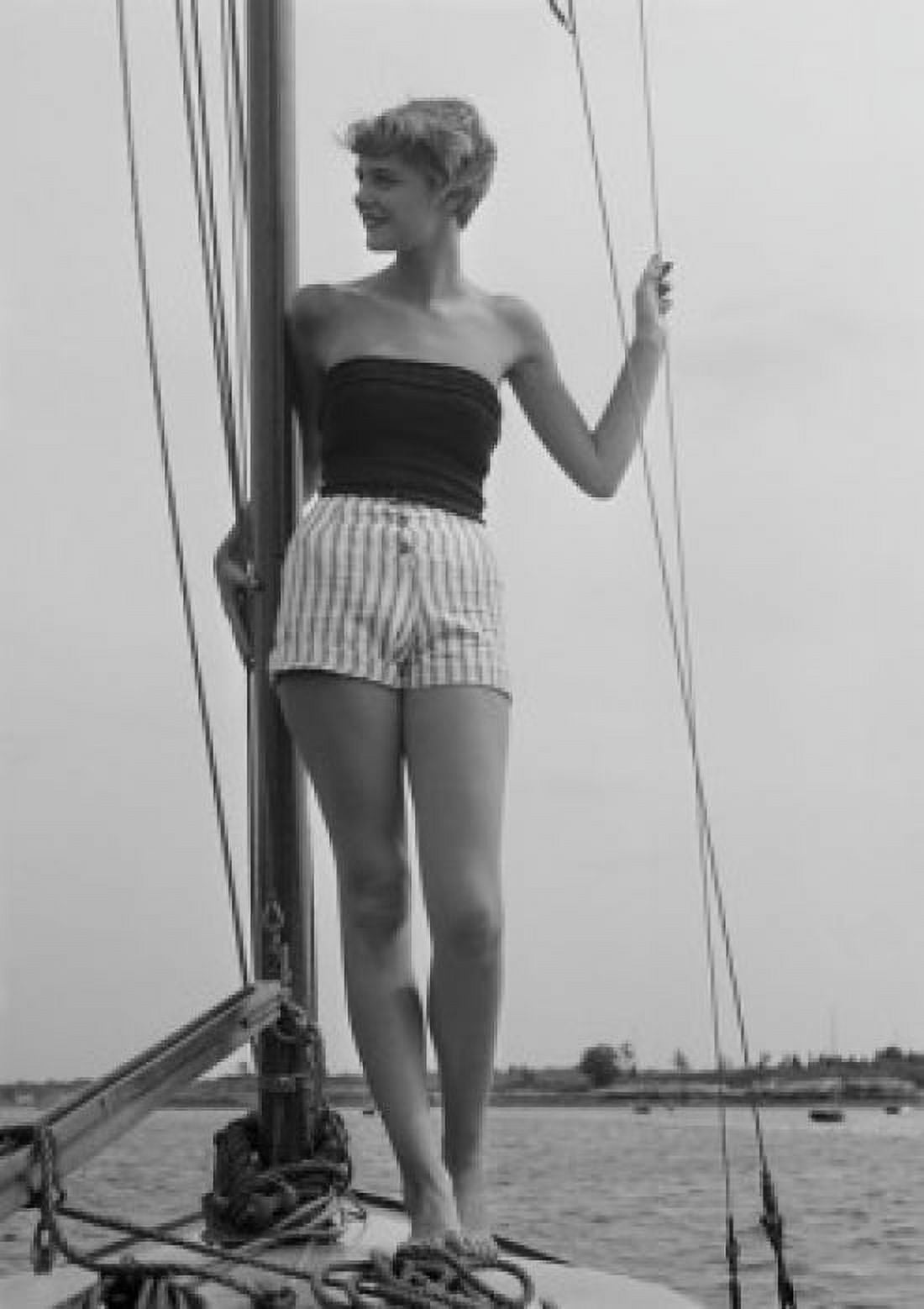 Young woman standing on deck of boat Canvas Art - (18 x 24)