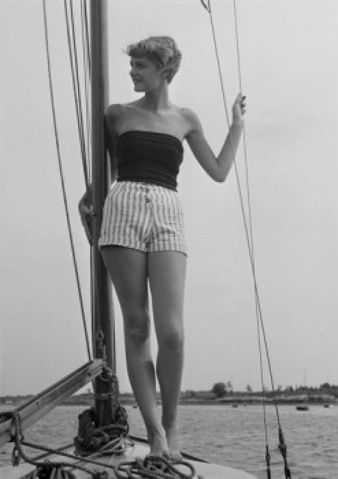 Young woman standing on deck of boat Canvas Art - (24 x 36)