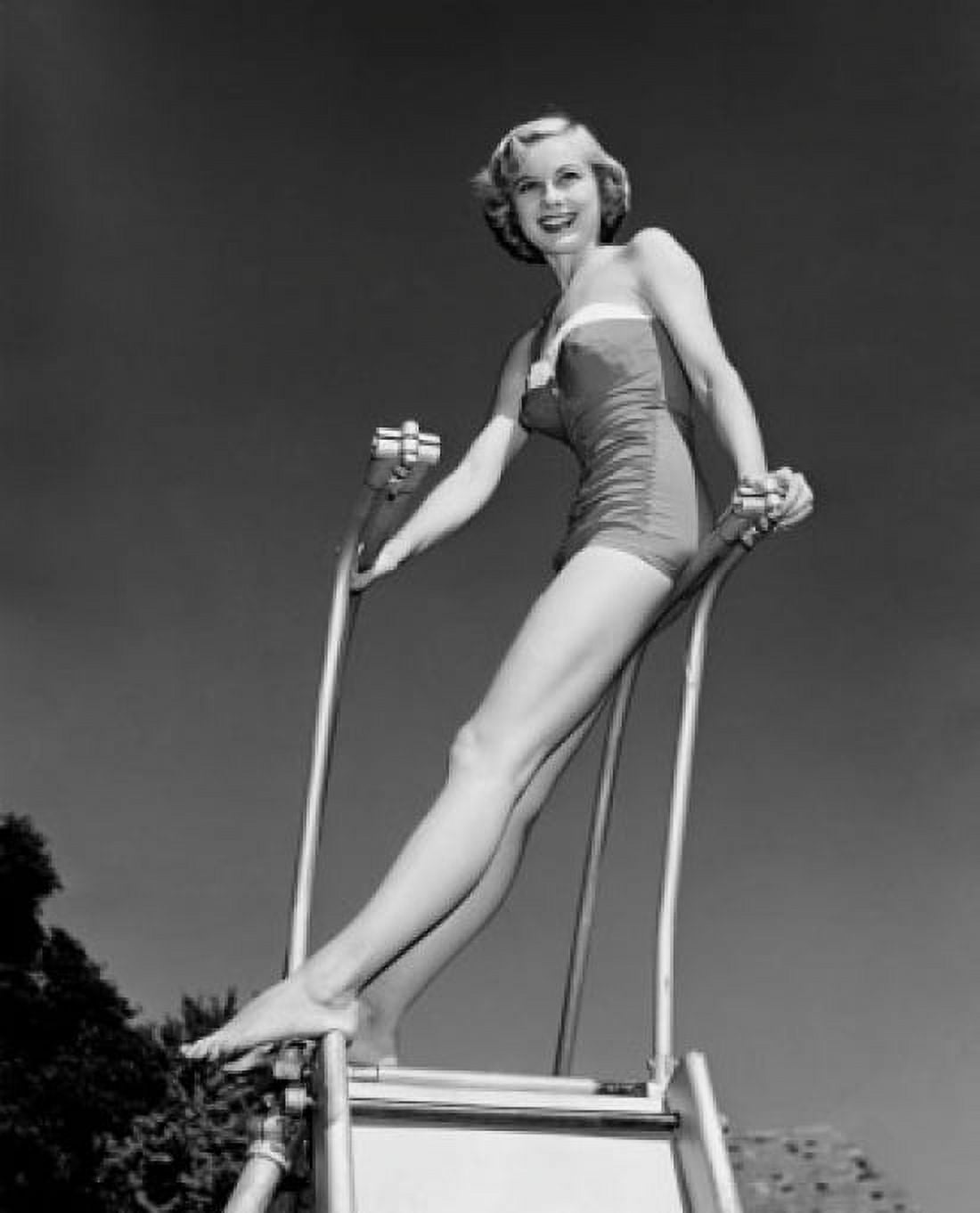 Young woman standing on diving board Canvas Art - (24 x 36)