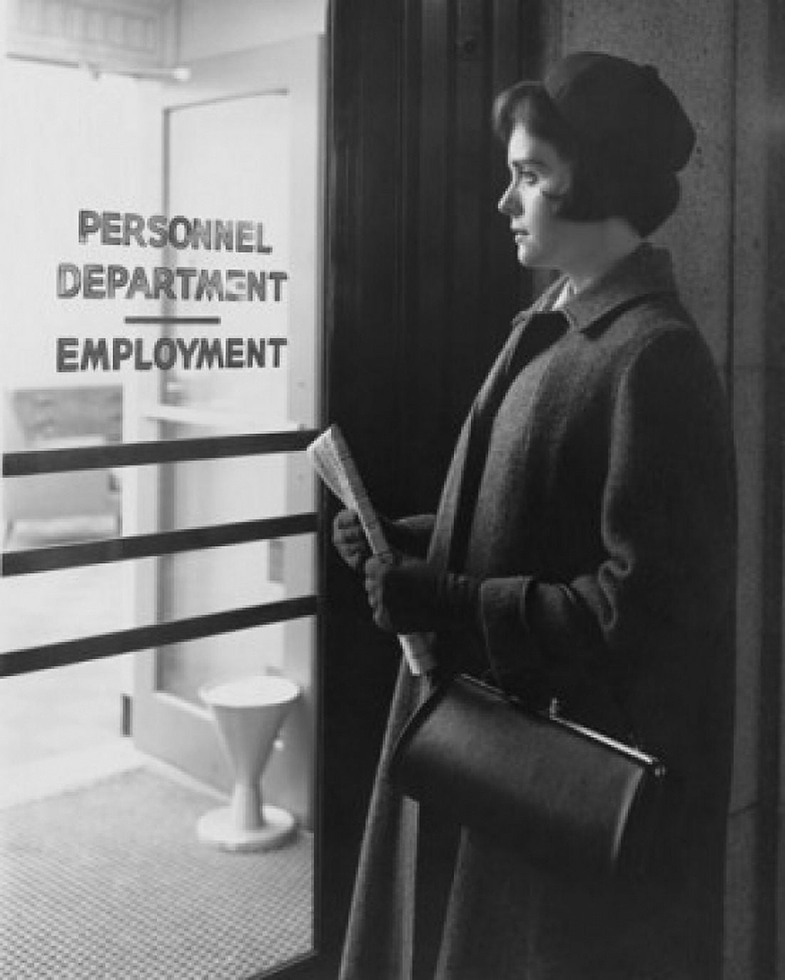 Young woman standing outside an employment office Canvas Art - (18 x 24)