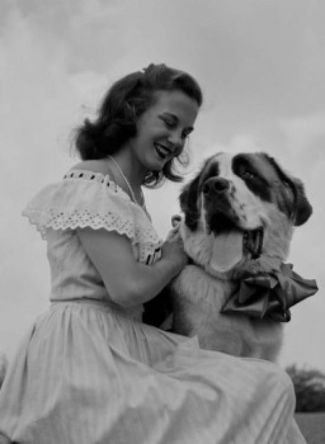 Young woman stroking St Bernard Dog Canvas Art - (18 x 24)
