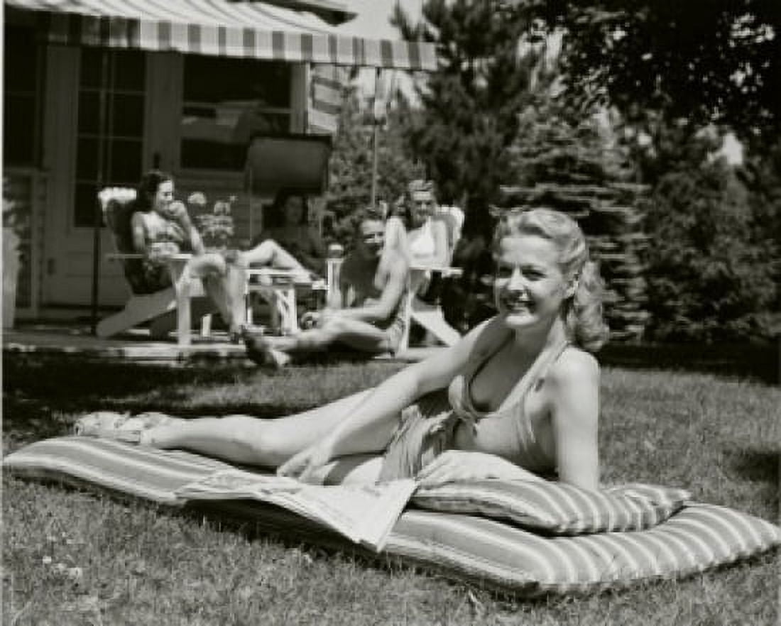 Young woman sunbathing in the backyard Canvas Art - (18 x 24)