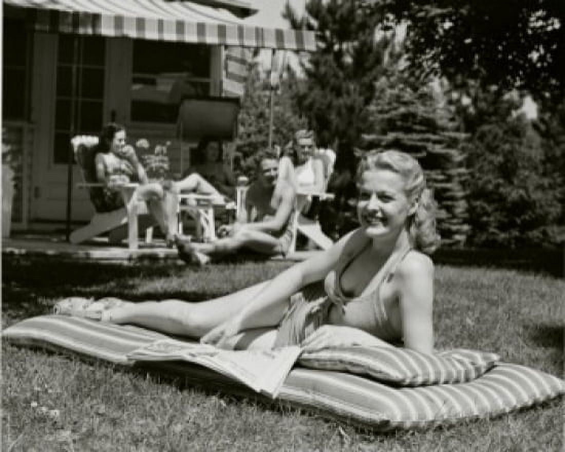 Young woman sunbathing in the backyard Canvas Art - (24 x 36)