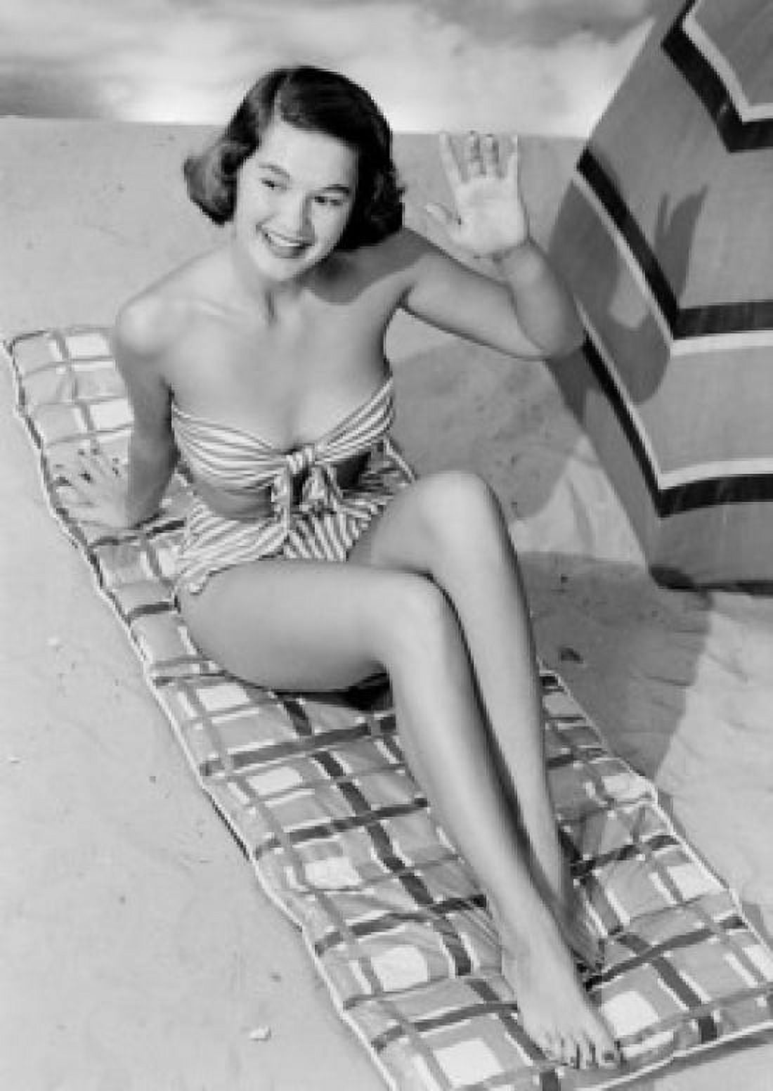 Young woman sunbathing waving Canvas Art - (18 x 24)