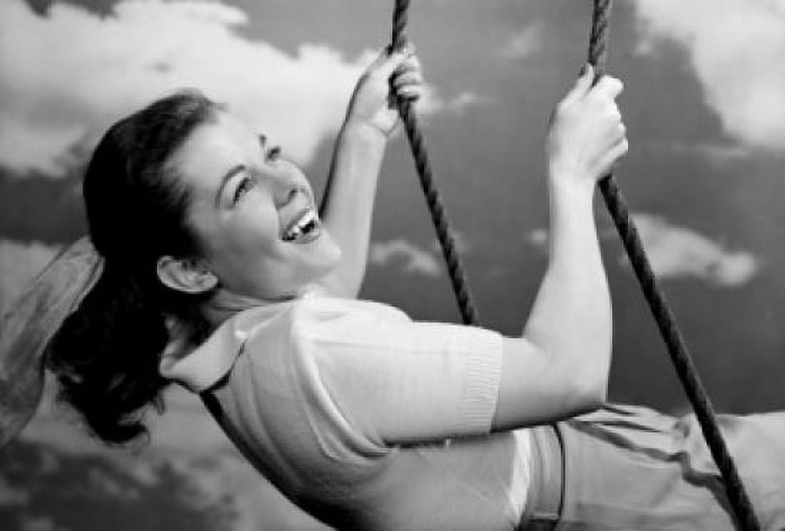 Young woman swinging and laughing Canvas Art - (18 x 24)