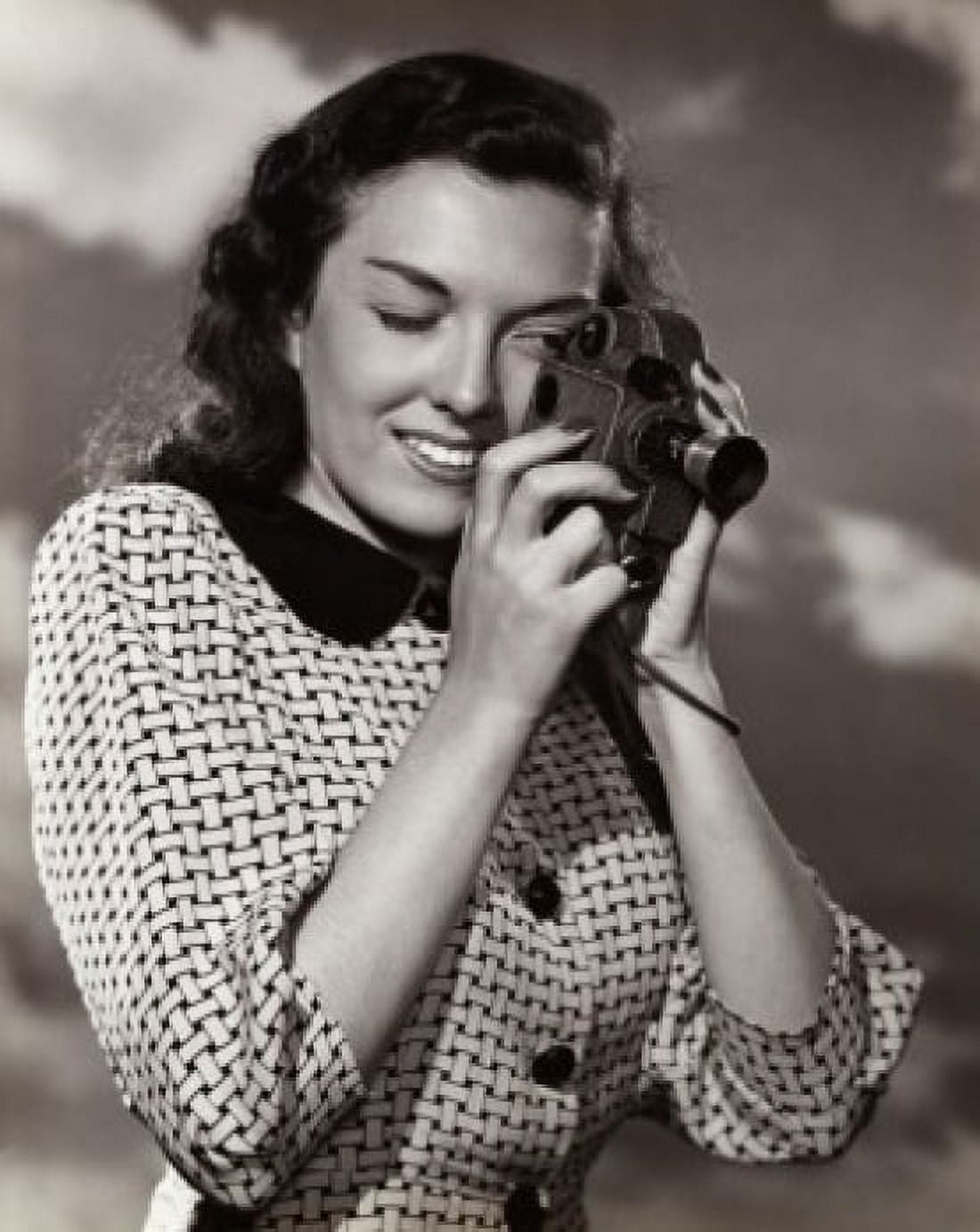 Young woman taking a photograph Canvas Art - (18 x 24)