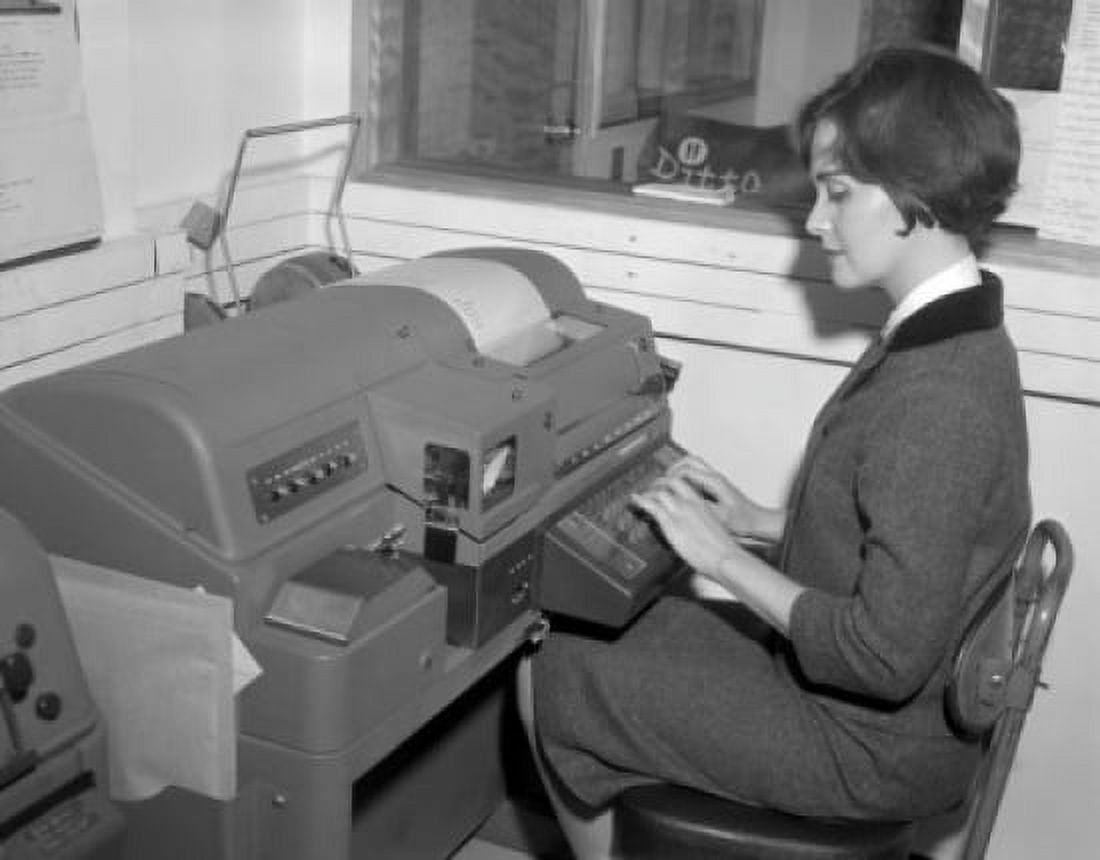 Young woman typing on printing machine Canvas Art - (18 x 24)