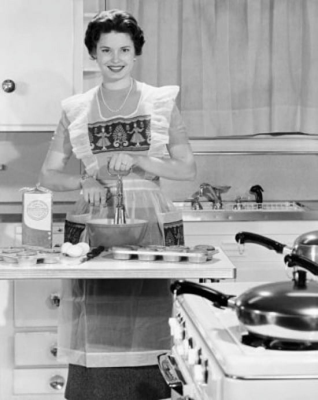 Young woman using egg beater in kitchen Canvas Art - (24 x 36)