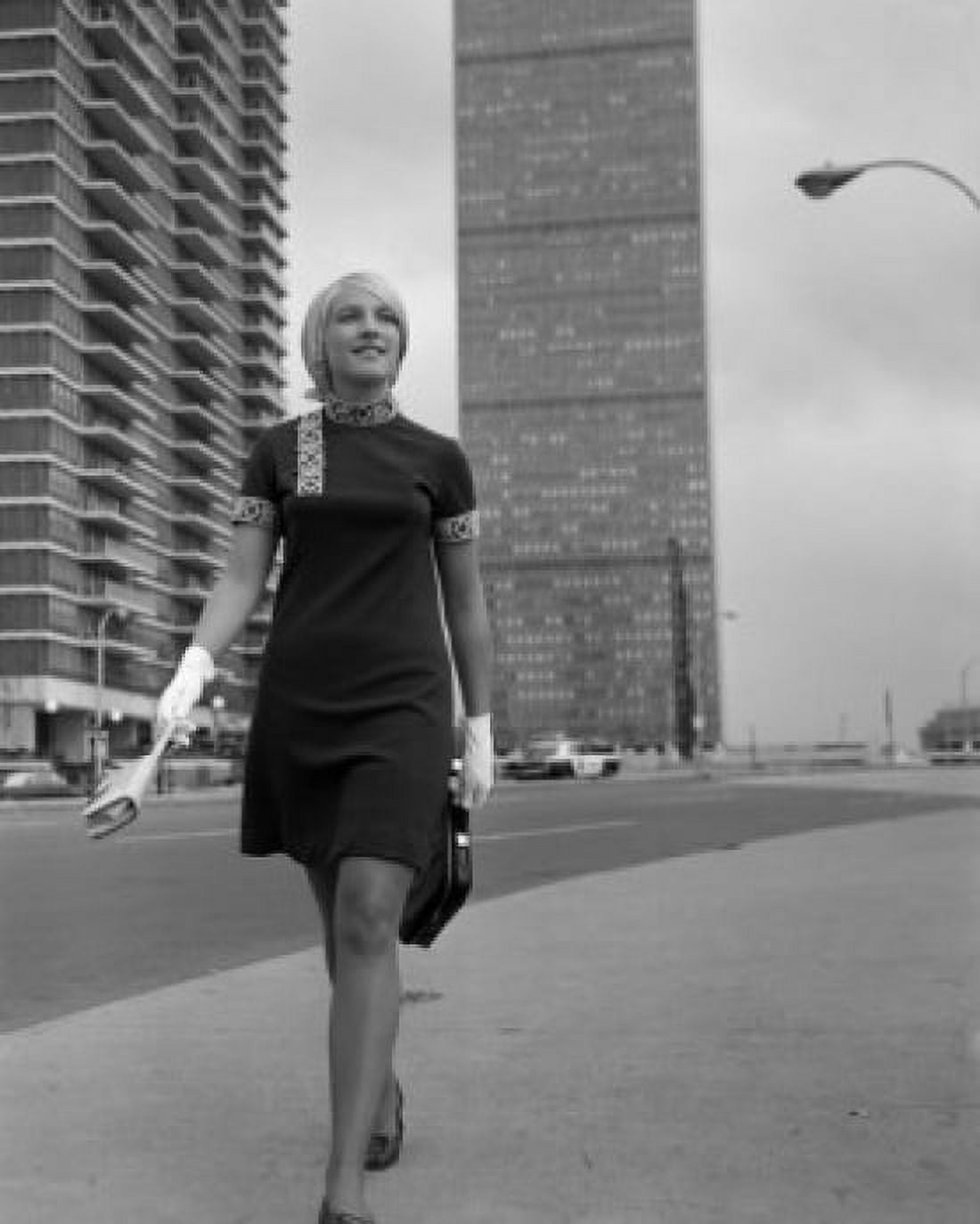 Young woman walking in street Canvas Art - (24 x 36)