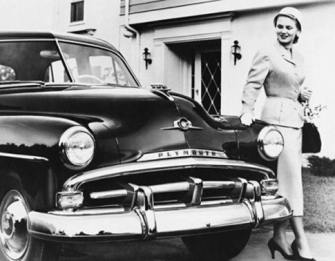 Young woman walking near a 1952 Plymouth Canvas Art - (18 x 24)