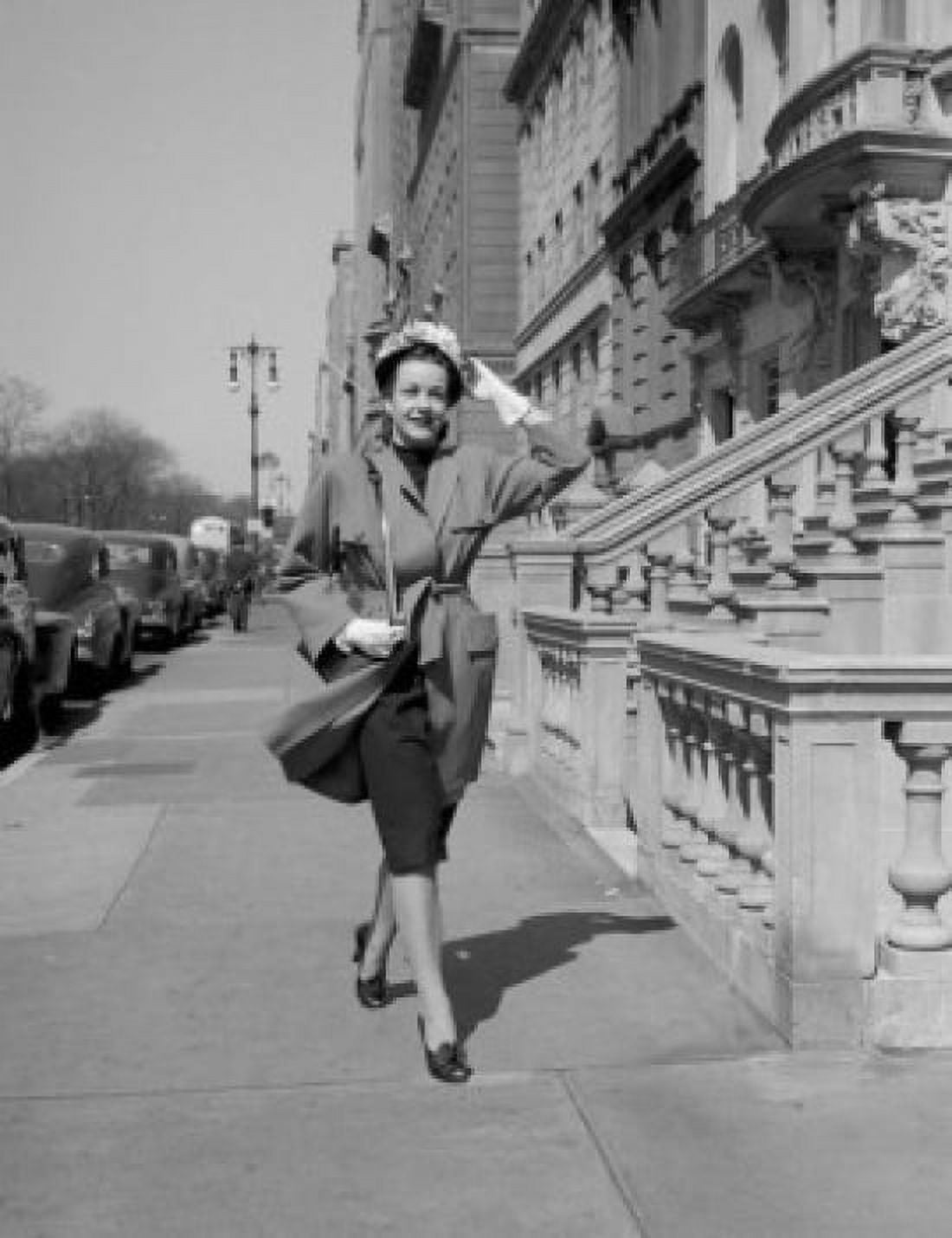 Young woman walking on pavement in city Canvas Art - (18 x 24)
