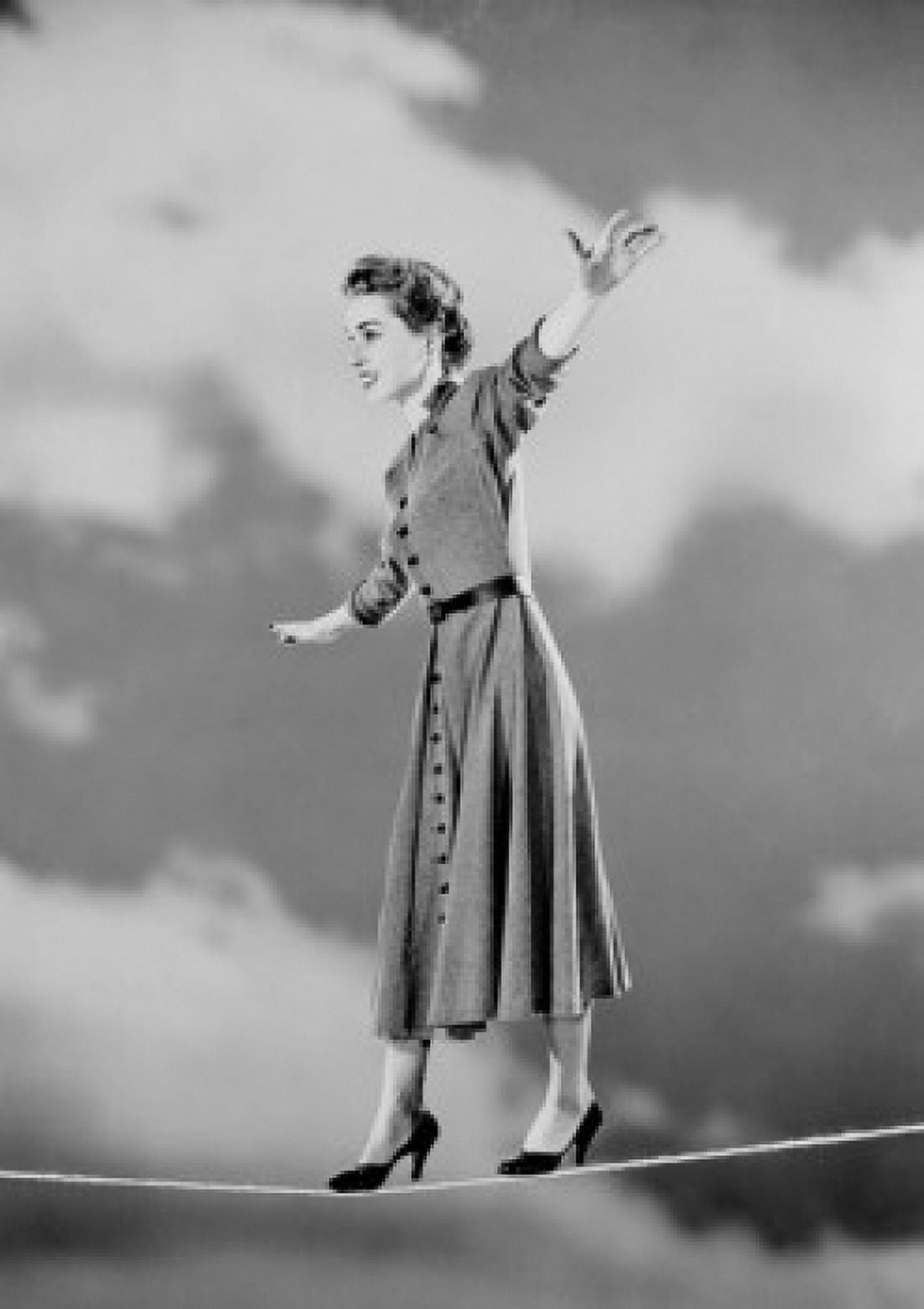 Young woman walking on tight rope Canvas Art - (24 x 36)