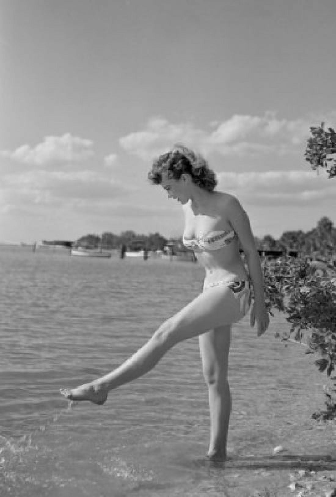Young woman walking over lake Canvas Art - (24 x 36)