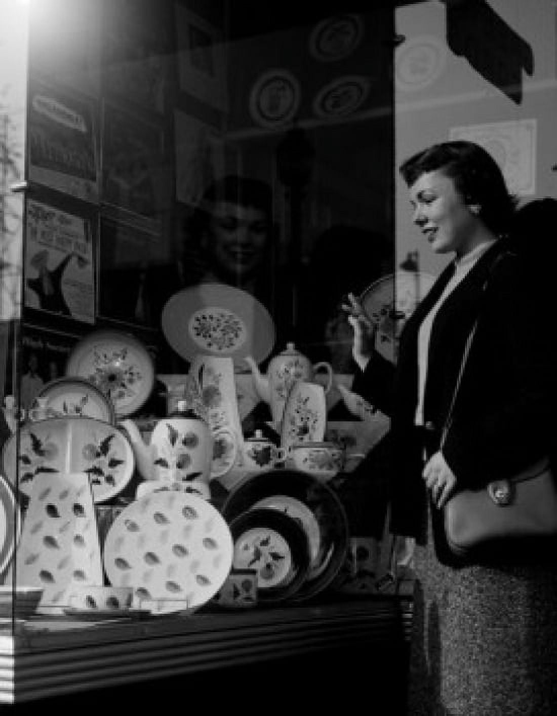 Young woman watching china at window display Canvas Art - (24 x 36)