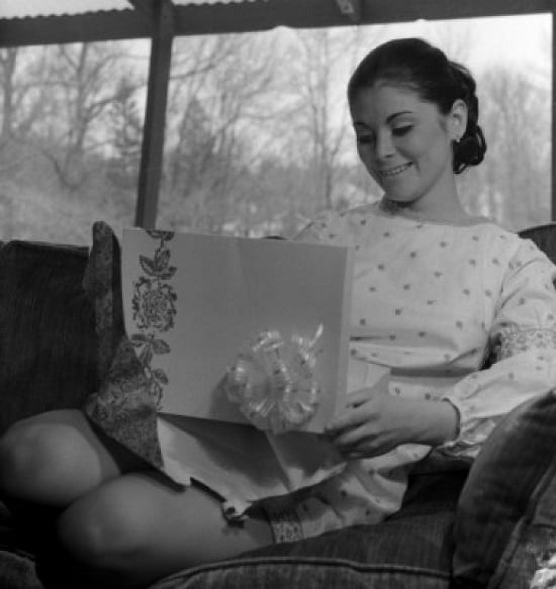 Young woman watching gift Canvas Art - (24 x 36)