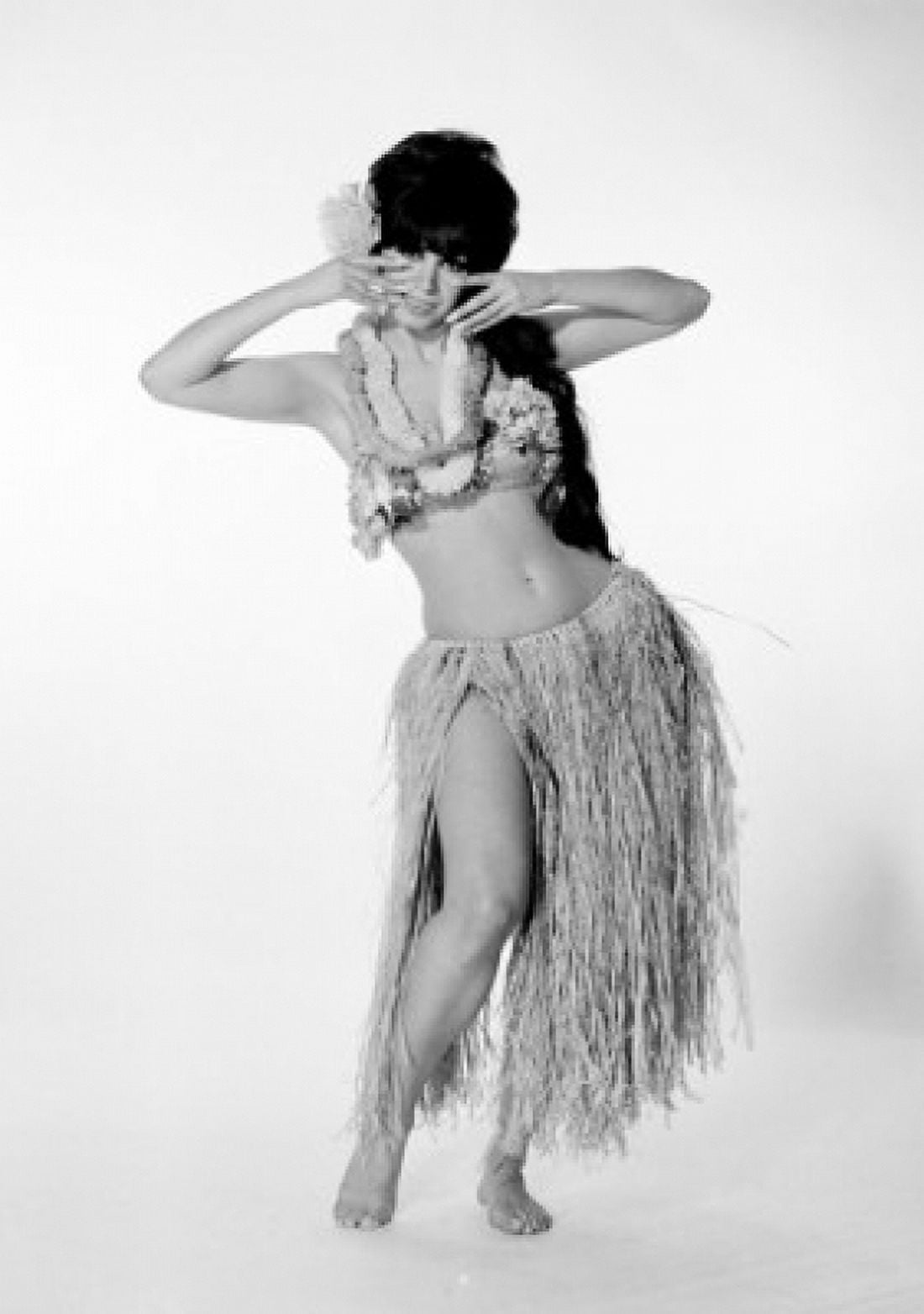 Young woman wearing grass skirt bikini and garlands Canvas Art - (24 x 36)