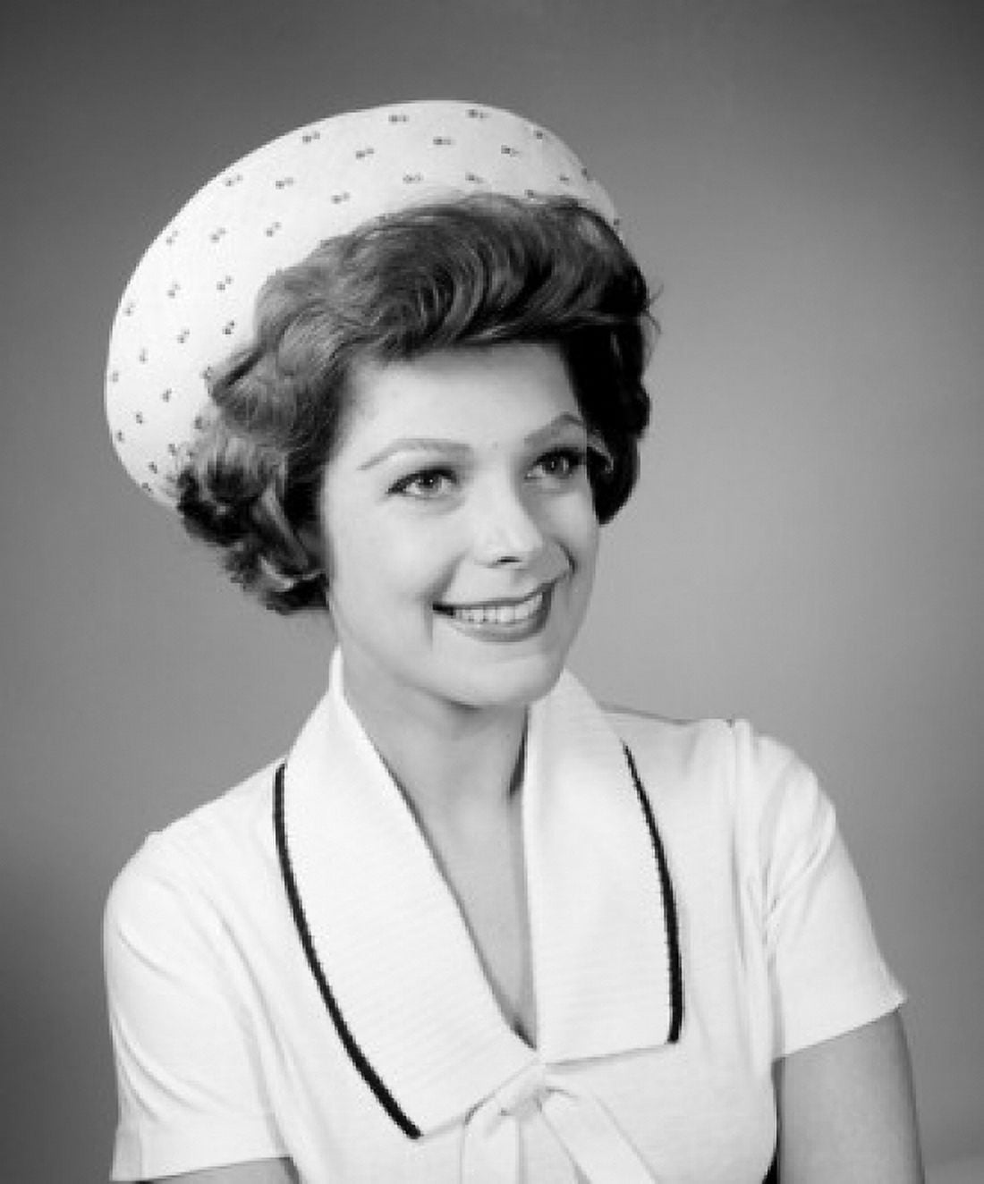 Young woman wearing hat smiling Canvas Art - (24 x 36)
