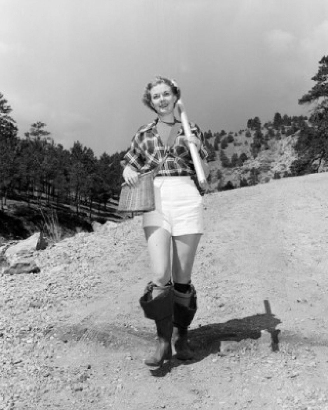 Young woman wearing wellingtons carrying fishing net and basket Canvas Art - (18 x 24)