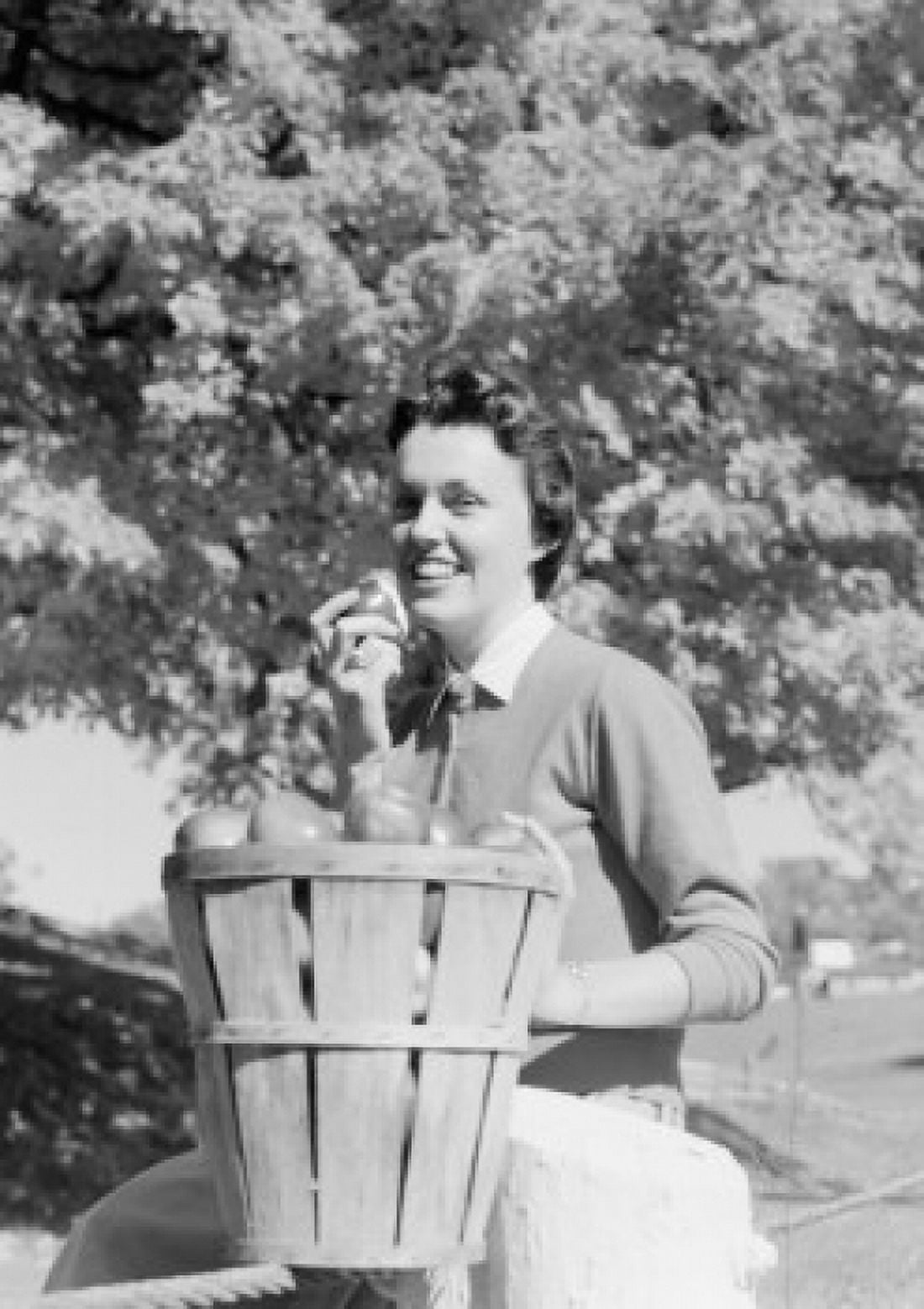 Young woman with bucket of apples Canvas Art - (18 x 24)