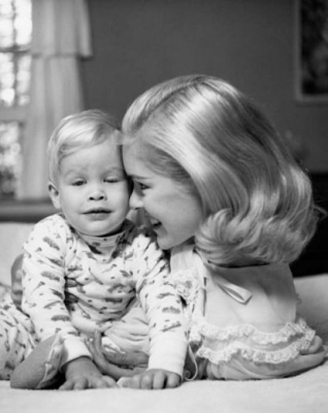 Young woman with her son on the bed Canvas Art - (18 x 24)