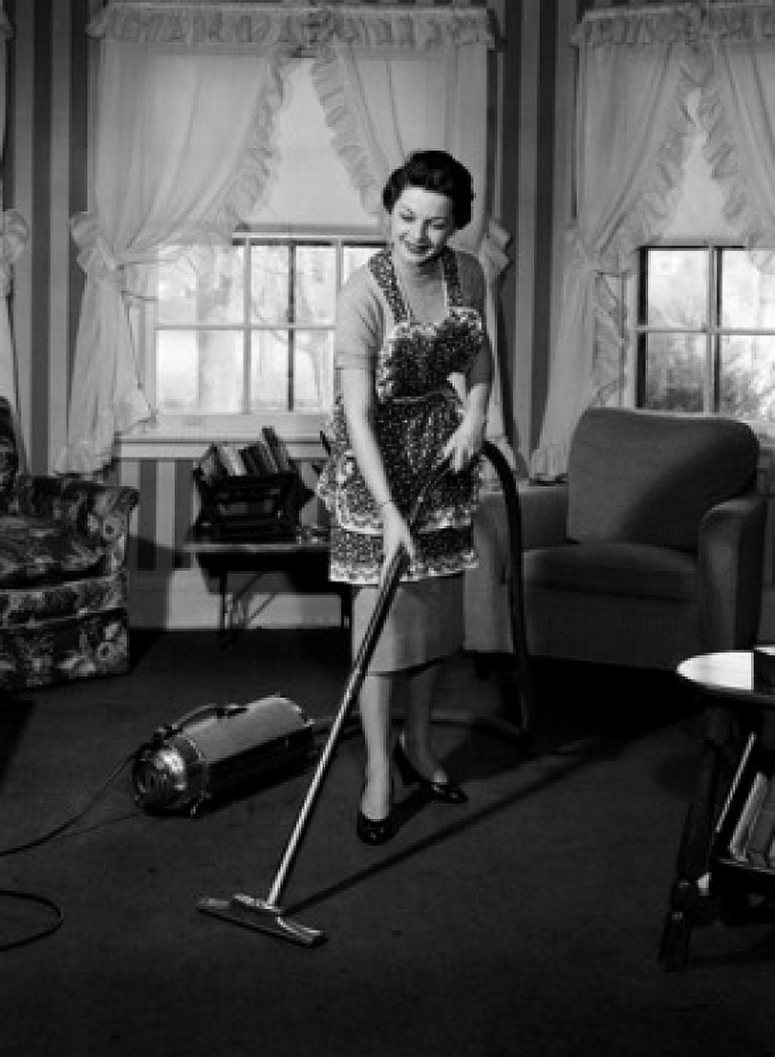 Young woman with vacuum cleaner Canvas Art - (18 x 24)