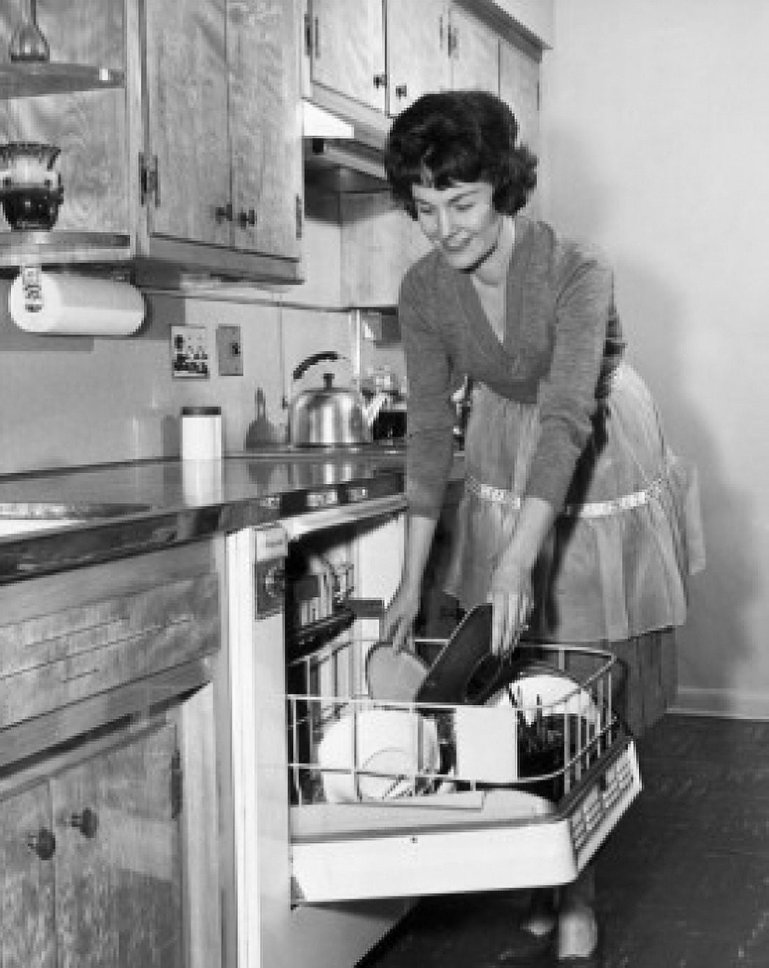 Young woman working in a kitchen Canvas Art - (18 x 24)