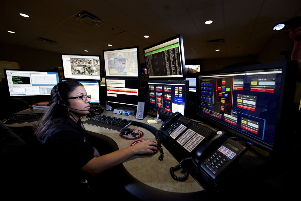 Young woman working in the emergency service dispatch control room Canvas Art - Terry MooreStocktrek Images (35 x 24)
