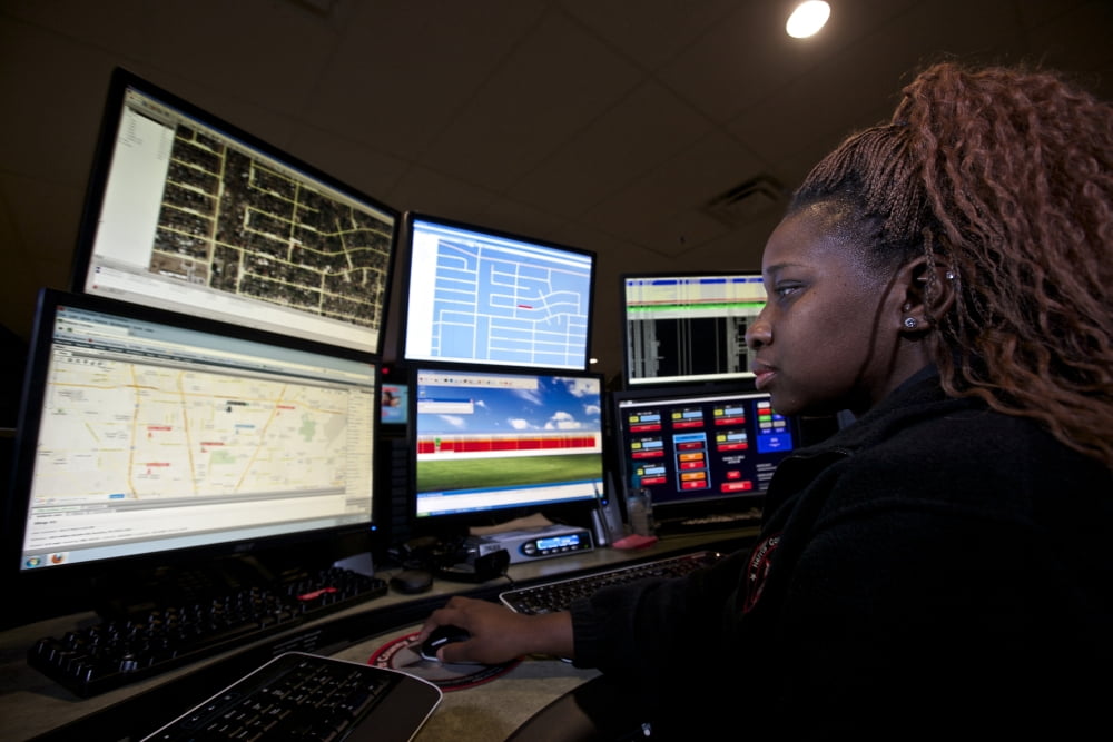 Young woman working in the emergency service dispatch control room Canvas Art - Terry MooreStocktrek Images (35 x 24)
