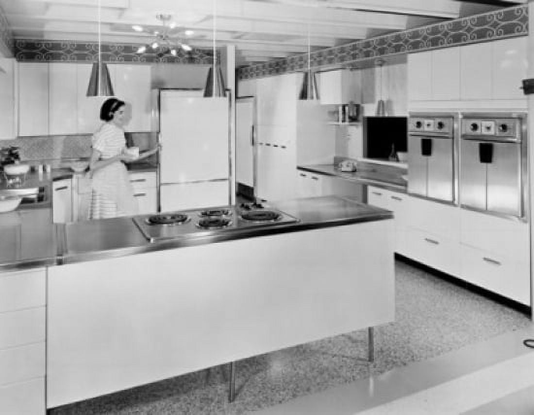 Young woman working in the kitchen Canvas Art - (24 x 36)