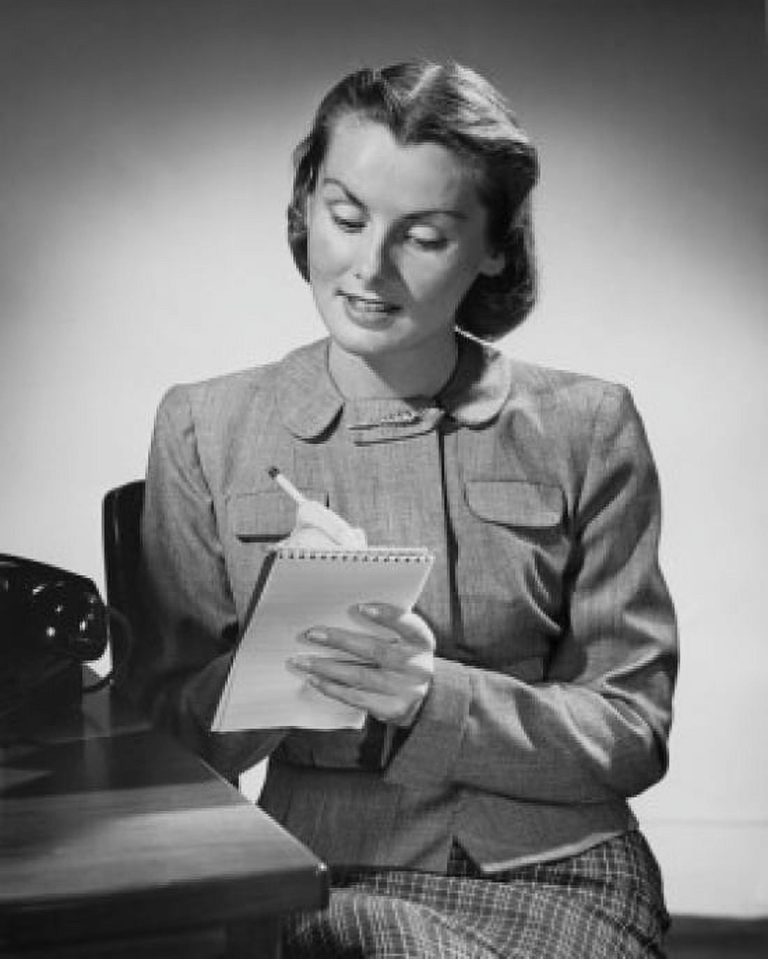 Young woman writing on a notepad Canvas Art - (18 x 24)