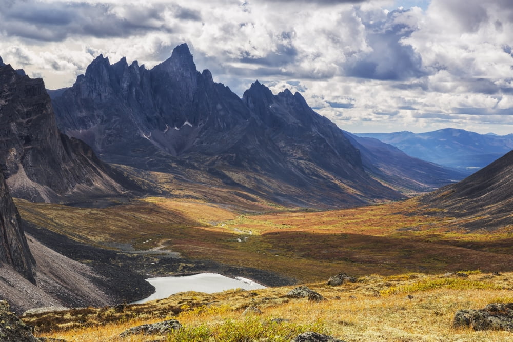 In the Yukons North country Tombstone mountain stands out above the tundra and surrrounding landscape Yukon Canada Canvas Art - Robert Postma Design Pics (38 x 24)