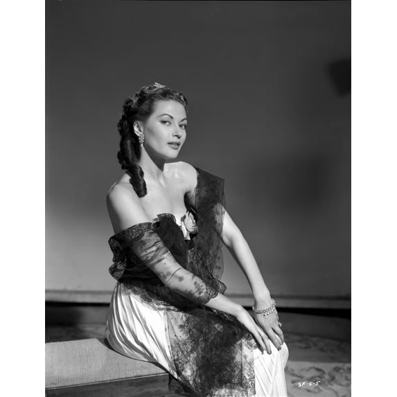 Yvonne Decarlo sitting in Black Strapless Dress with Net Dress Photo Print (8 x 10)