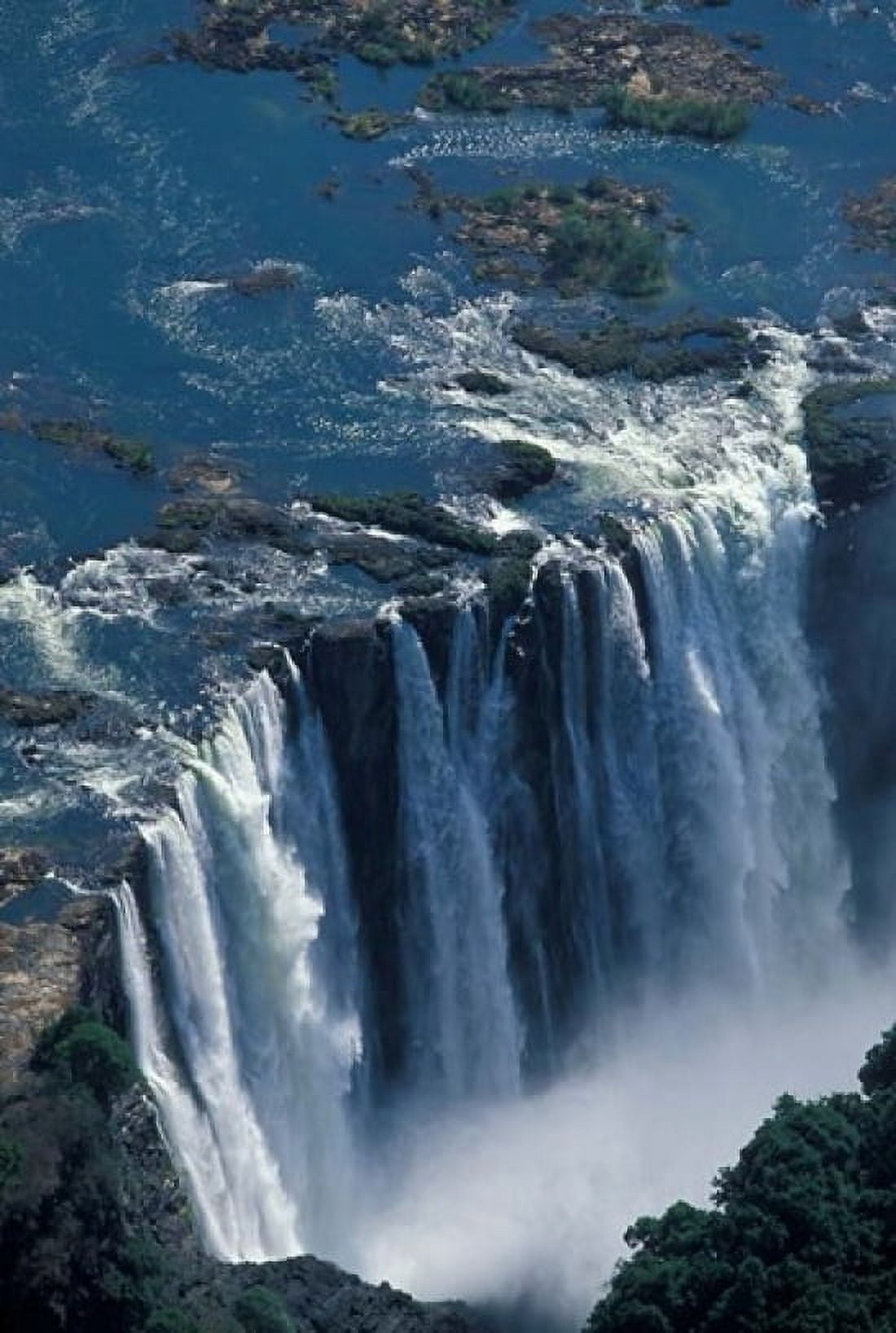 Zambezi River Flowing over Victoria Falls Mosi-Oa-Tunya National Park Zambia Canvas Art - Paul Souders DanitaDelimont (12 x 17)