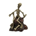 thumbnail image 1 of Zeckos 7 inch Creepy Skeleton Sitting On Rocks Figurine, 1 of 3