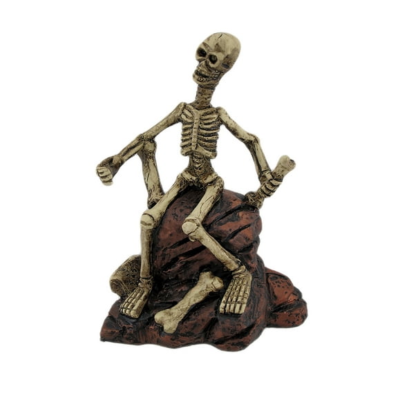 Zeckos 7 inch Creepy Skeleton Sitting On Rocks Figurine