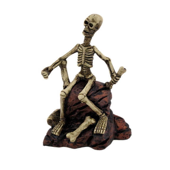 Zeckos 7 inch Creepy Skeleton Sitting on Rocks Figurine