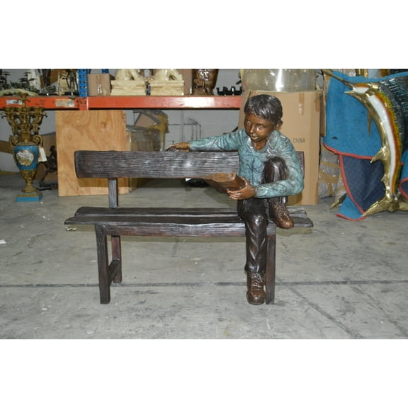 boy Sitting on a Bench reading book bronze Statue -  Size: 43"L x 20"W x 36"H.