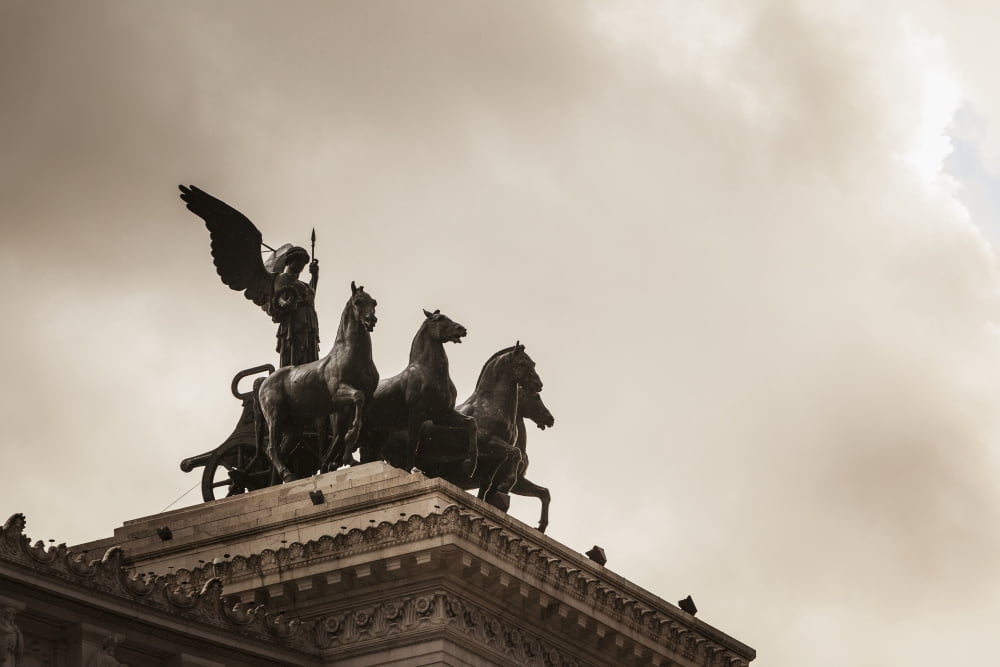 On either side of the roof-top viewing area was the goddess Victoria riding on quadrigas Rome Italy Canvas Art - Reynold Mainse Design Pics (38 x 24)