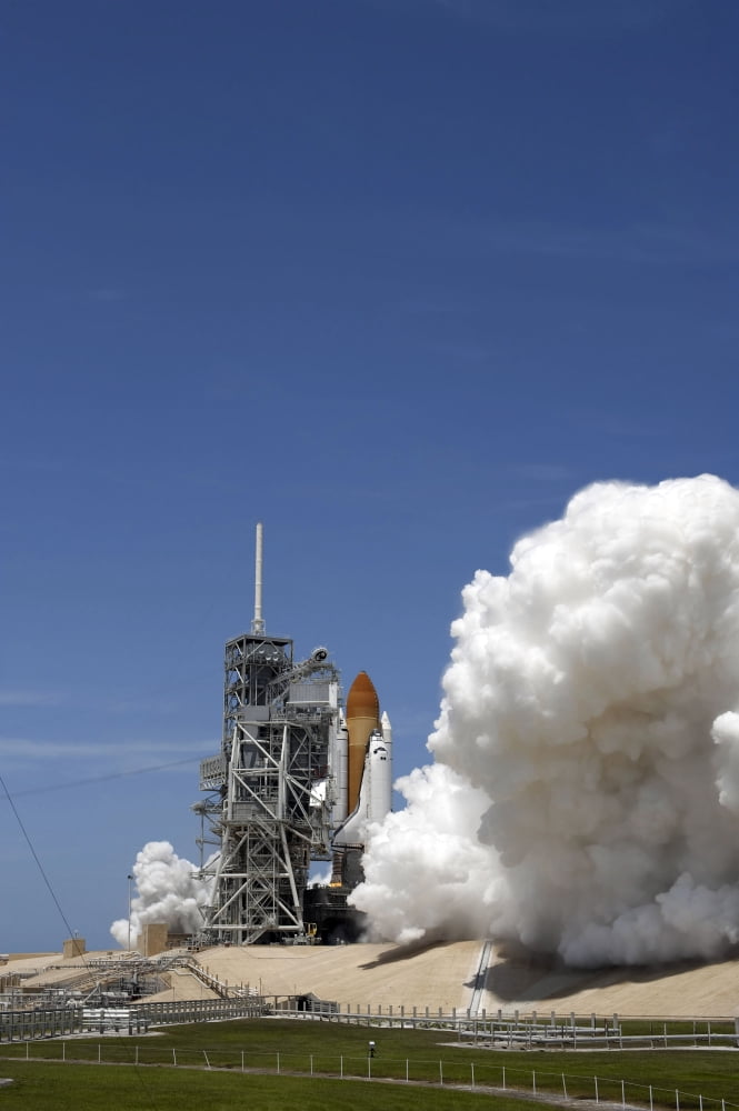An exhaust plume forms around the base of Launch Pad 39A as space shuttle Atlantis lifts off on the STS-132 mission Canvas Art - Stocktrek Images (23 x 34)
