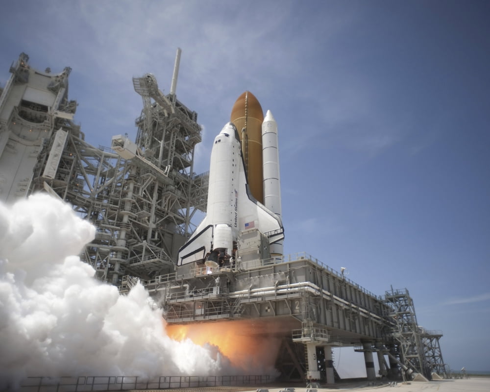 An exhaust plume forms under the mobile launcher platform on Launch Pad 39A as space shuttle Atlantis lifts off into orbit Canvas Art - Stocktrek Images (32 x 26)