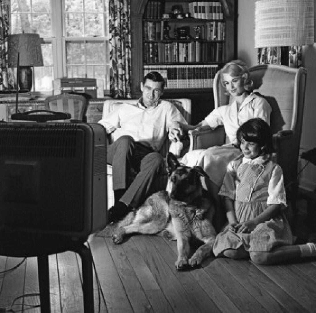 family with dog and daughter in front of television Canvas Art - (24 x 36)