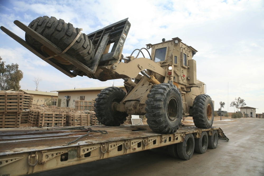forklift is unloaded off of a logistics support vehicle Canvas Art - Stocktrek Images (35 x 23)