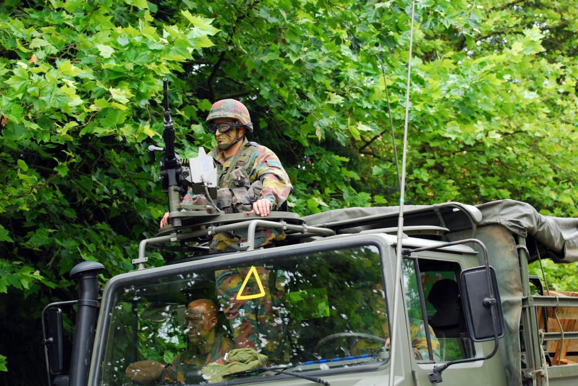 An infantry soldier of the Belgian Army mans a FN MAG machine gun mounted on top of the Unimog vehicle Canvas Art - Luc De JaegerStocktrek Images (34 x 23)