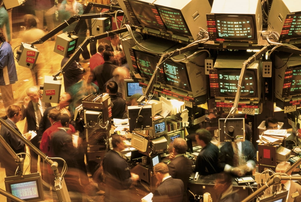 This is the interior of the New York Stock Exchange on Wall Street It shows traders looking at the monitors on the walls tracking the Dow Jones Canvas Art - Panoramic Images (27 x 9)