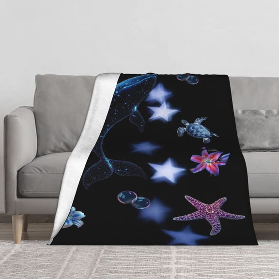 This magical underwater universe flannel blanket features shimmering sequins of blue whales, turtles, and purple starfish. Soft and lightweight, it's perfect for sofas and beds.