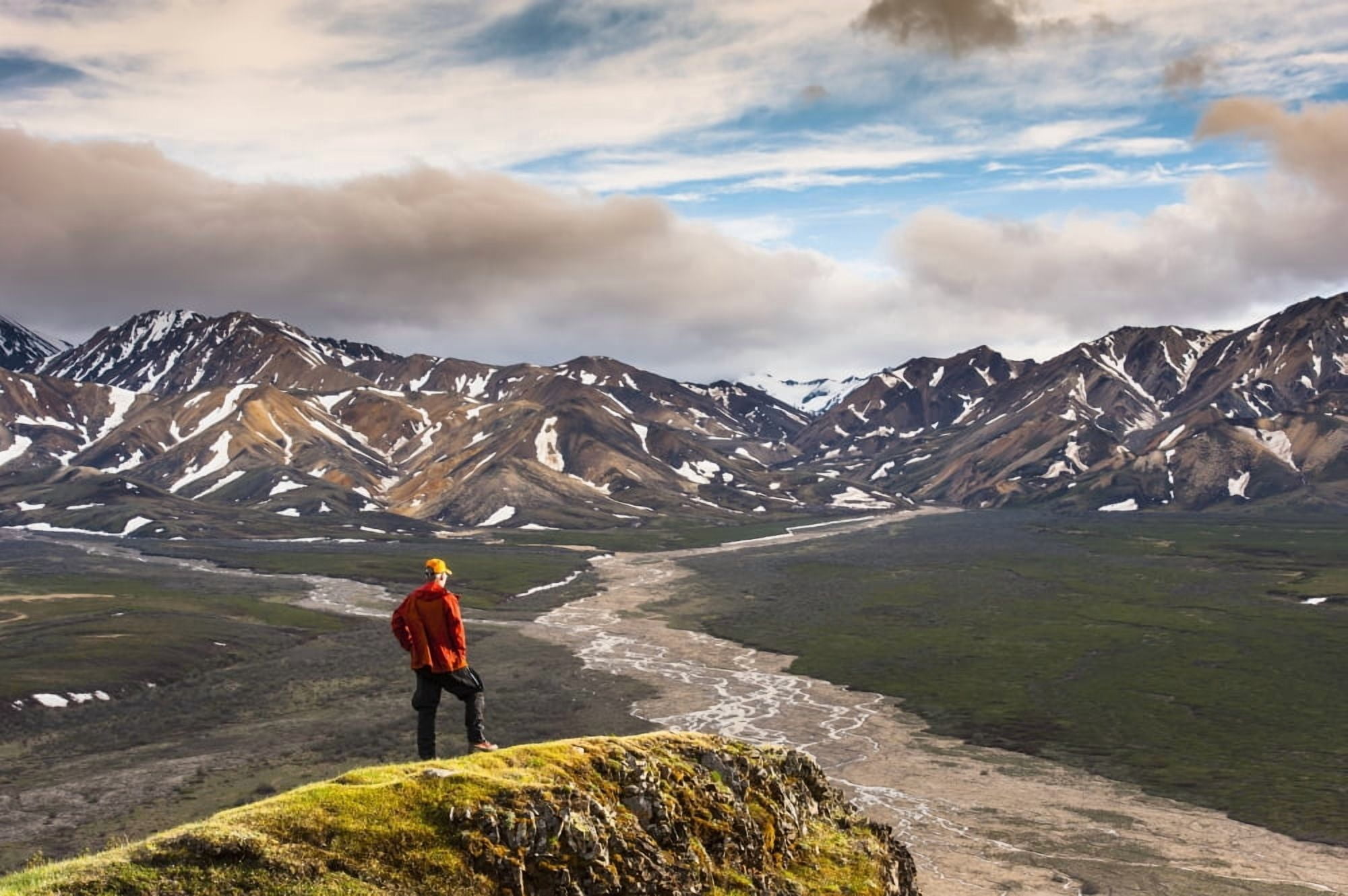 A man standing on a bluff at Polychome Pass with the Plains of Murie and the Alaska Range in the background Denali National Park Interior Alaska Canvas Art - Michael Jones Design Pics (19 x 12)