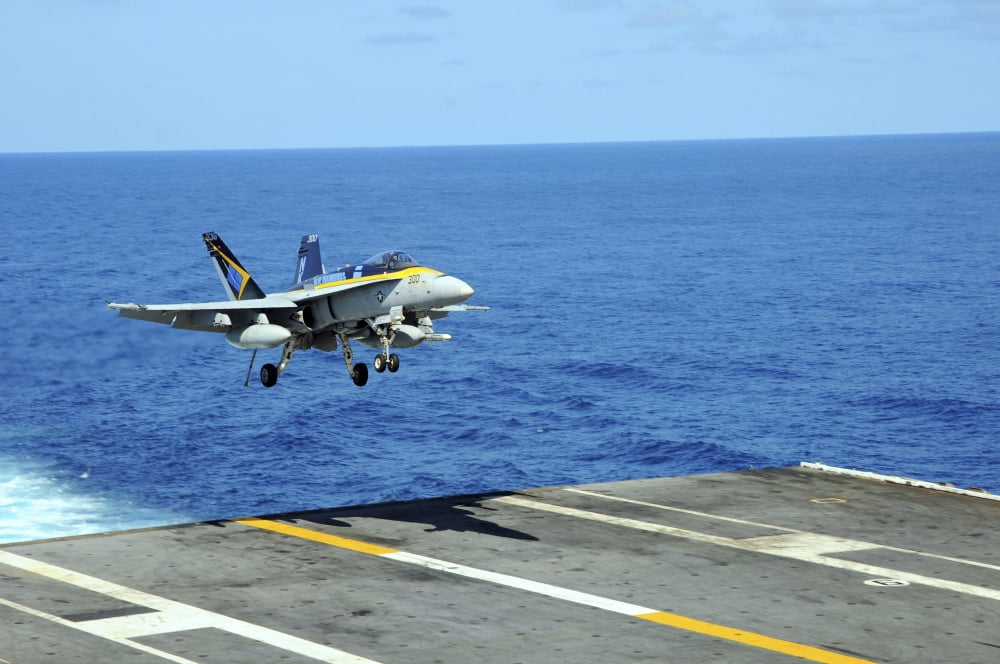 n FA-18C Hornet lands aboard the aircraft carrier USS Ronald Reagan Canvas Art - Stocktrek Images (35 x 23)