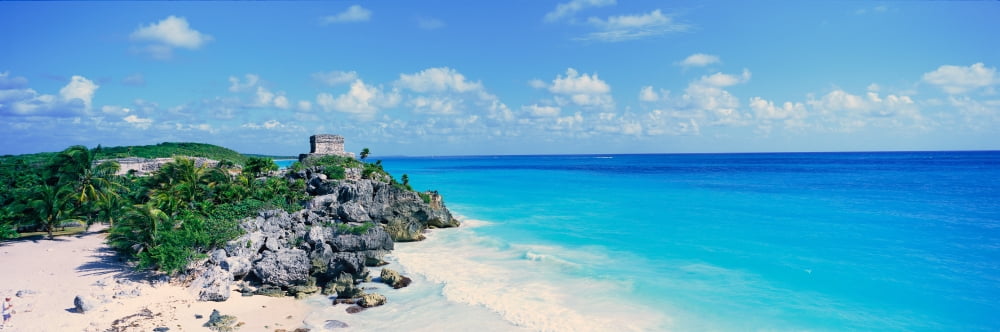 A panoramic view of the Templo del Dios del Viento Mayan ruins of Ruinas de Tulum (Tulum Ruins) in Quintana Roo Yucatan Peninsula Mexico Canvas Art - Panoramic Images (27 x 9)